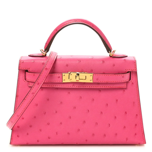 Vivid Bright Fuchsia Dotted Embossed Compact Sharp Cut Rectangular Handbag With Radiant Golden Twist Lock Hardware And Curved Top Handle